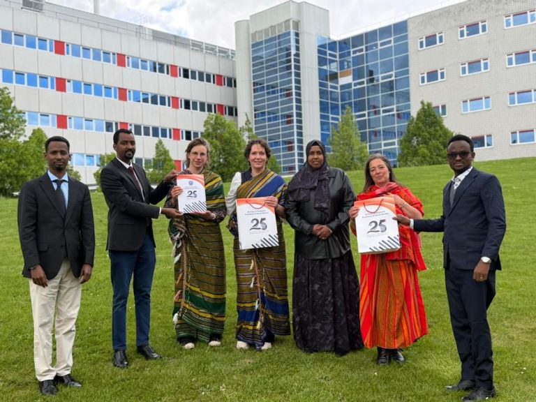 CURIOUS study visit participants from Somalia and their European hosts standing together outside a partner university campus
